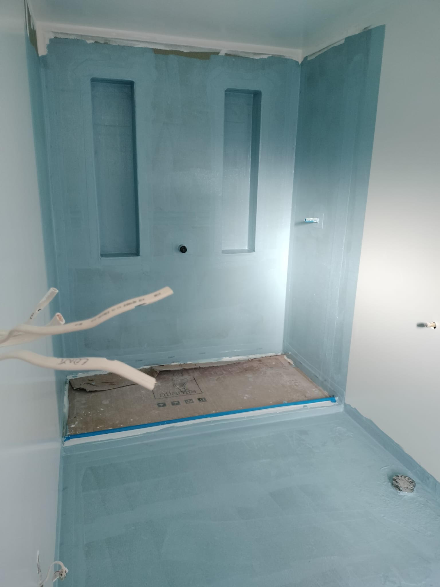Waterproofing completed around the preformed tray during the Christchurch walk-in shower project